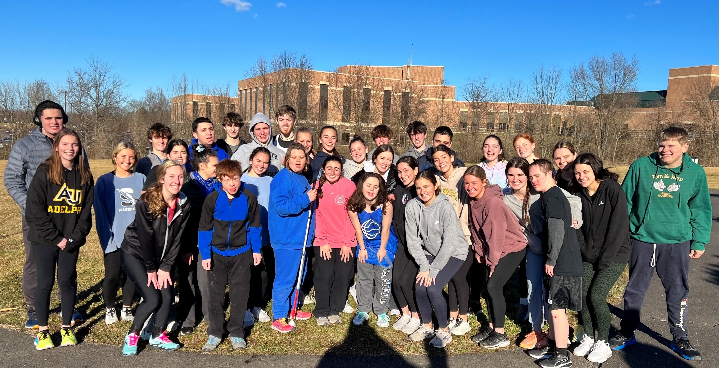 A group of people posing for a photoDescription automatically generated
